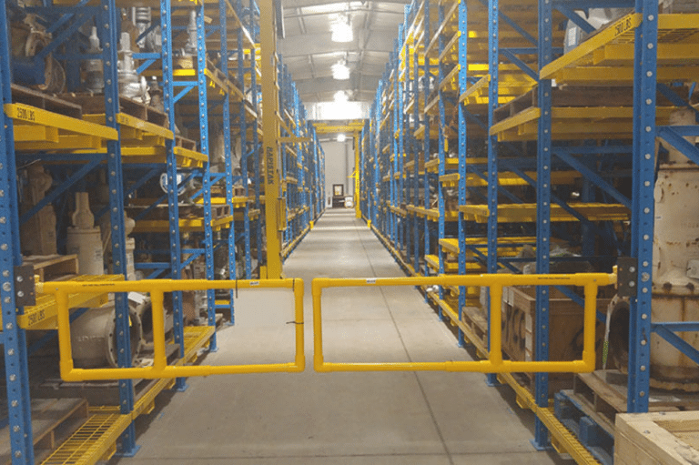 A large warehouse featuring yellow and blue shelves and modern innovative safety gate designs for enhanced security.