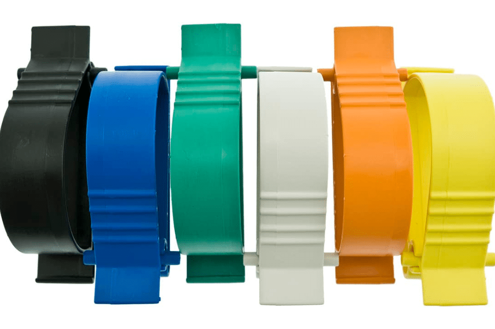 A collection of five colorful plastic clips displayed together, featured as the Utility Catcher® multipurpose clip.